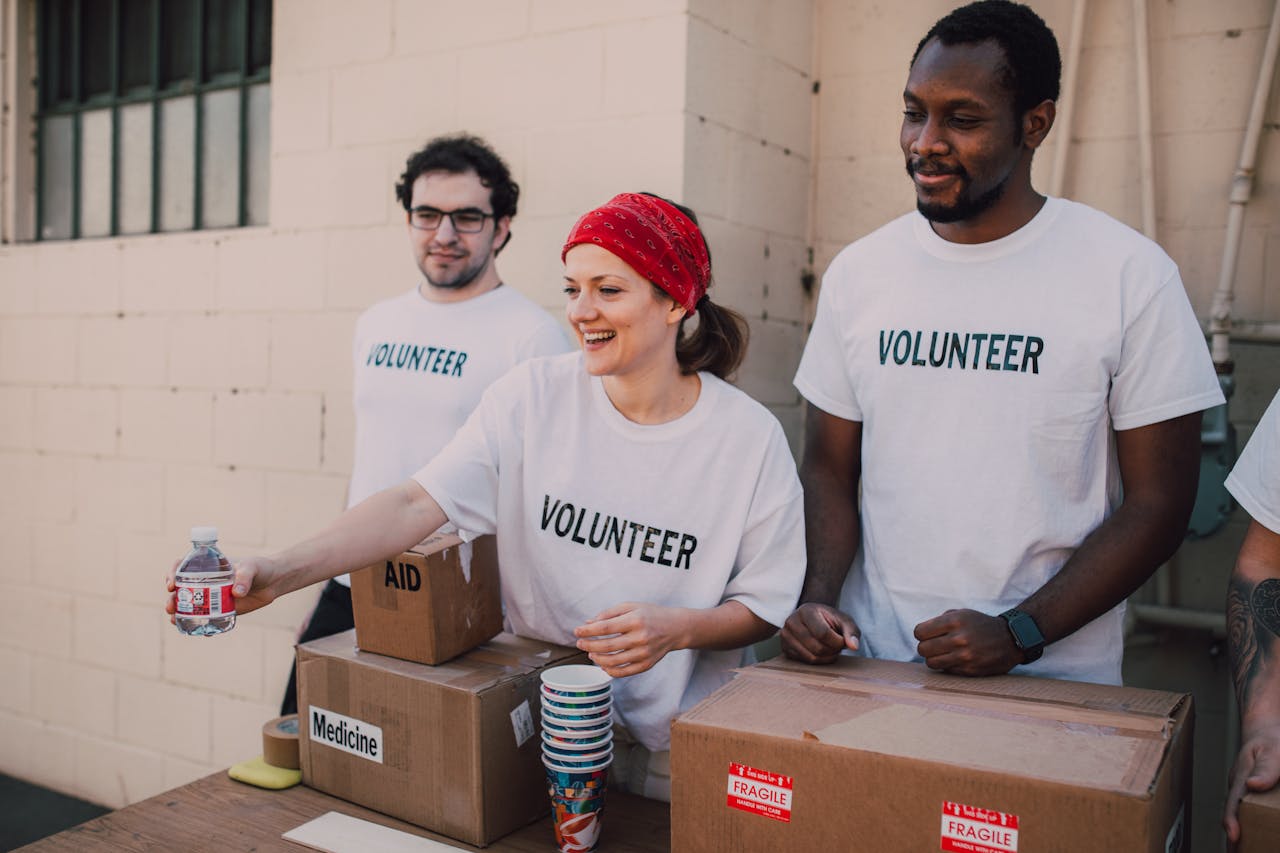 Volunteers serving food to people in need
